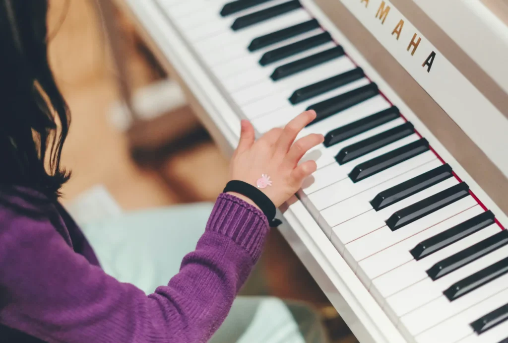 child is learning piano and music theory