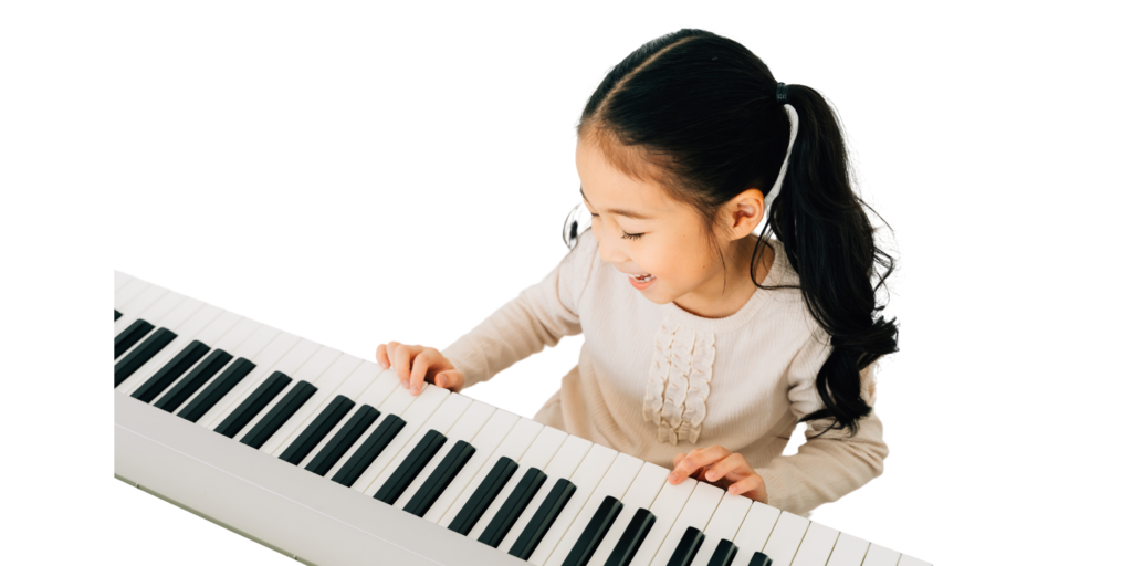 child plays the keyboard, digital piano