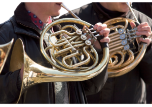a person is playing french horn