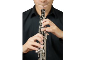 a person is playing oboe