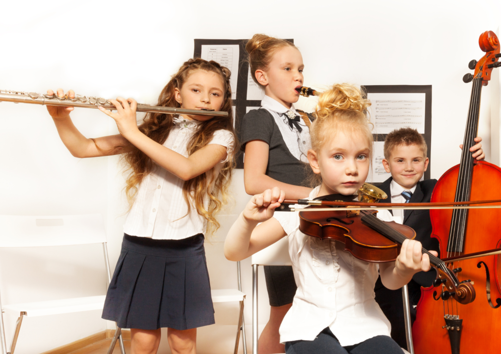 kids are playing musical instruments in a group